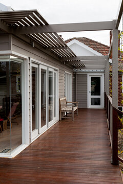 Home extension of weatherboard, merbau decking and steel with bench