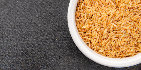 Brown rice whole grain cereal product superfood fresh tasty gourmet food background on the table rustic food top view copy space