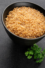 Brown rice whole grain cereal product superfood fresh tasty gourmet food background on the table rustic food top view copy space