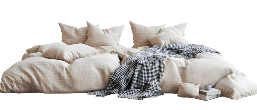 A cozy bedding arrangement featuring soft pillows, a textured blanket, and a casual throw, creating a warm and inviting atmosphere for relaxation and comfort.