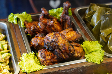 Traditional Indonesian Cuisine, captured on June 16, 2025. A rich variety of authentic dishes made with local spices and ingredients, featuring rice, meats, vegetables, and sambal.