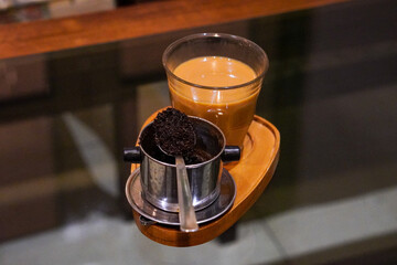 Vietnamese Drip Coffee, Indonesia, captured on June 16, 2025. Traditional coffee brewed using a metal drip filter, slowly producing bold and aromatic flavor, served with sweetened condensed milk.