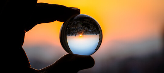 Crystal Ball Sunset Reflection. Inverted Cityscape at Golden Hour