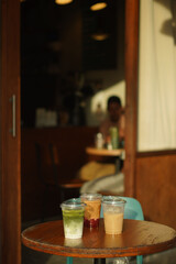 Closeup of Iced Caramel Macchiato at the coffee shop, Caramel Macchiato is a classic macchiato beverage. It consists of vanilla syrup, espresso, steamed milk, foam, and caramel drizzle