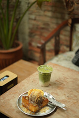matcha and toast bread on the wood table
