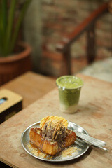 matcha and toast bread on the wood table