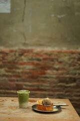 matcha and toast bread on the wood table