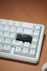 The black enter key on a mechanical keyboard with a monochrome theme
