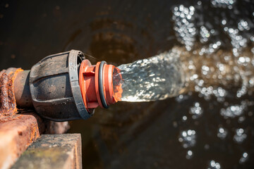pumping water to dam on farm poly pipe water irrigation repair on a farm in australia for a water trough in summer