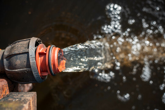 pumping water to dam on farm poly pipe water irrigation repair on a farm in australia for a water trough in summer