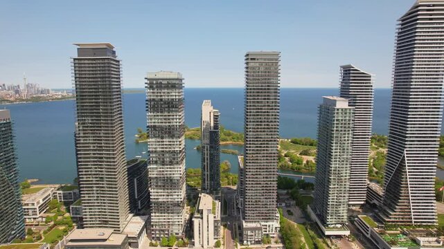 Aerial view of Humber Bay Shores, Etobicoke near Toronto area is chic waterfront gem. Epic cityscape condos buildings, vibrant green park trails near lakefront scenic escapes and modern living. Mimico