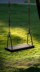 Empty Swing Set in a Sunny Green Park