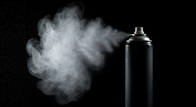 A black spray can in action releasing a cloud of mist against a dark background