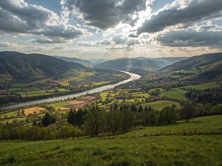 Naklejka premium Valley Farms and River under Dappled Sunlight from Above