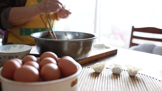 Making dumplings from scratch - squishing the dumpling dough to make the dumpling wrapper skins