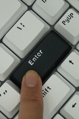 The black enter key on a mechanical keyboard with a monochrome theme