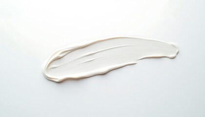 Texture of a white cream smear on a white surface in studio shot.