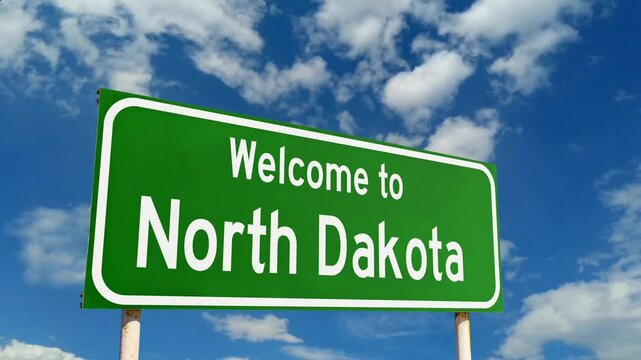 North Dakota welcome billboard at the entrance to the state. Welcome To North Dakota Green Road Sign.