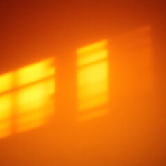 Warm sunlight reflections on a textured wall creating an orange ambiance