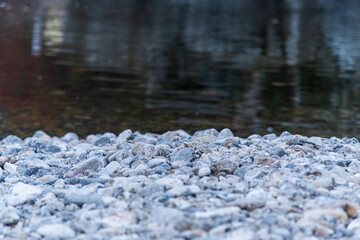 pebble shore and stream in the autumn valley