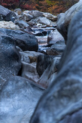 rocks and waterfall in the autumn valley