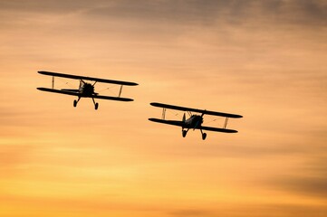 airplane landing at sunset