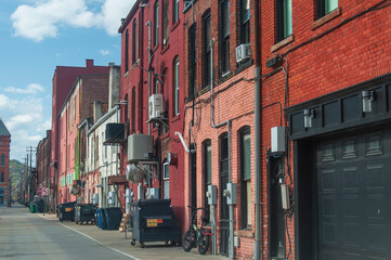 corning new york back alleyway behind brick buildings