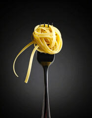 A single, perfect noodle hangs dramatically from a fork, seemingly defying gravity with silent determination.