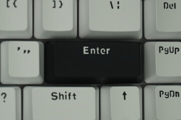 The black enter key on a mechanical keyboard with a monochrome theme