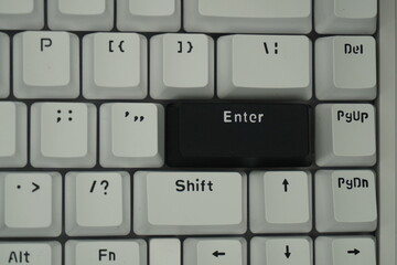 The black enter key on a mechanical keyboard with a monochrome theme