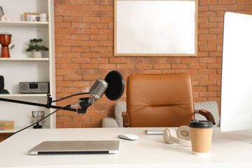 Workplace with microphone in recording studio