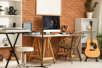 Interior of recording studio with workplace and musical instruments