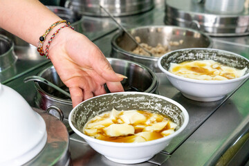 A delicious bowl of soft tofu pudding, known as 