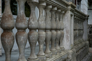 Dirty old vintage concrete balcony columns