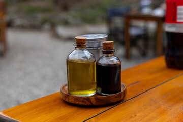 Vintage bottles with olive oil and balsamic vinegar
