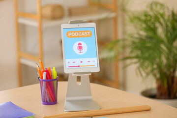 Tablet computer with record on table in podcaster's studio, closeup