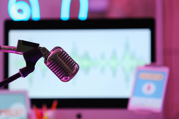 Professional microphone in dark podcaster's studio, closeup