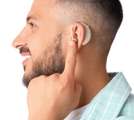 Young man with hearing aid on white background, closeup