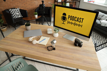 Podcaster's workplace with computer and microphone in studio