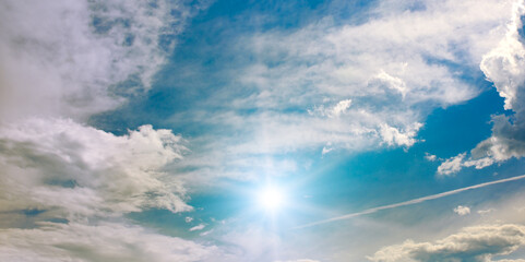 Beautiful cirrus clouds and sun against the sky.
