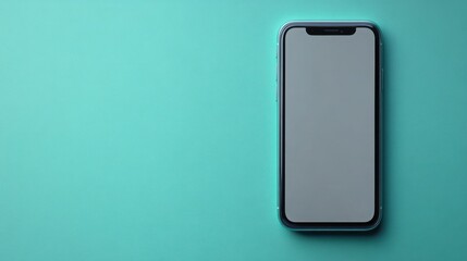 A cellphone resting on a light blue colored surface top