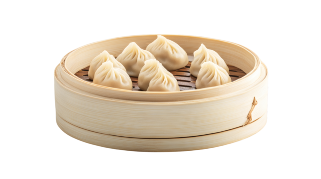 Handmade steamed momo dumplings arranged on bamboo steamer isolated on white background 