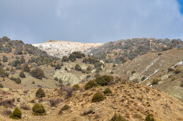 snow and rocks on top of Solak mountain near Bjni (Kotayk province, Armenia)	