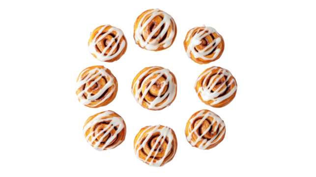 Freshly baked cinnamon rolls arranged in a spiral pattern with icing drizzle isolated on white background 