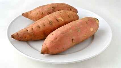 Sweet potatoes on white plate healthy vegetable photo