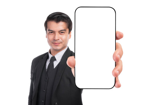 Confident businessman in black suit showing smartphone with blank screen towards camera, promoting app or digital content, isolated on a transparent background, close-up hand focus