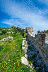 Akrokorinthos wall rising through spring hillside