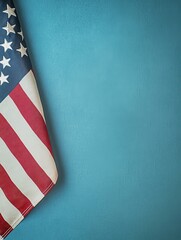 Obraz premium Patriotic American flag corner on soft blue background providing elegant copy space, ideal minimalist image for Memorial Day, Fourth of July greetings, or veteran tributes.