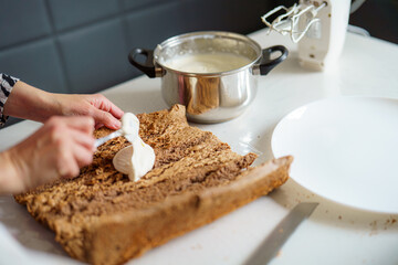 Baking a dessert with cream and a wooden surface in a contemporary kitchen