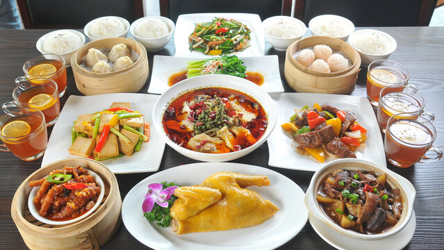 Asian Style Food Platter on Dining Table with Assorted Dishes